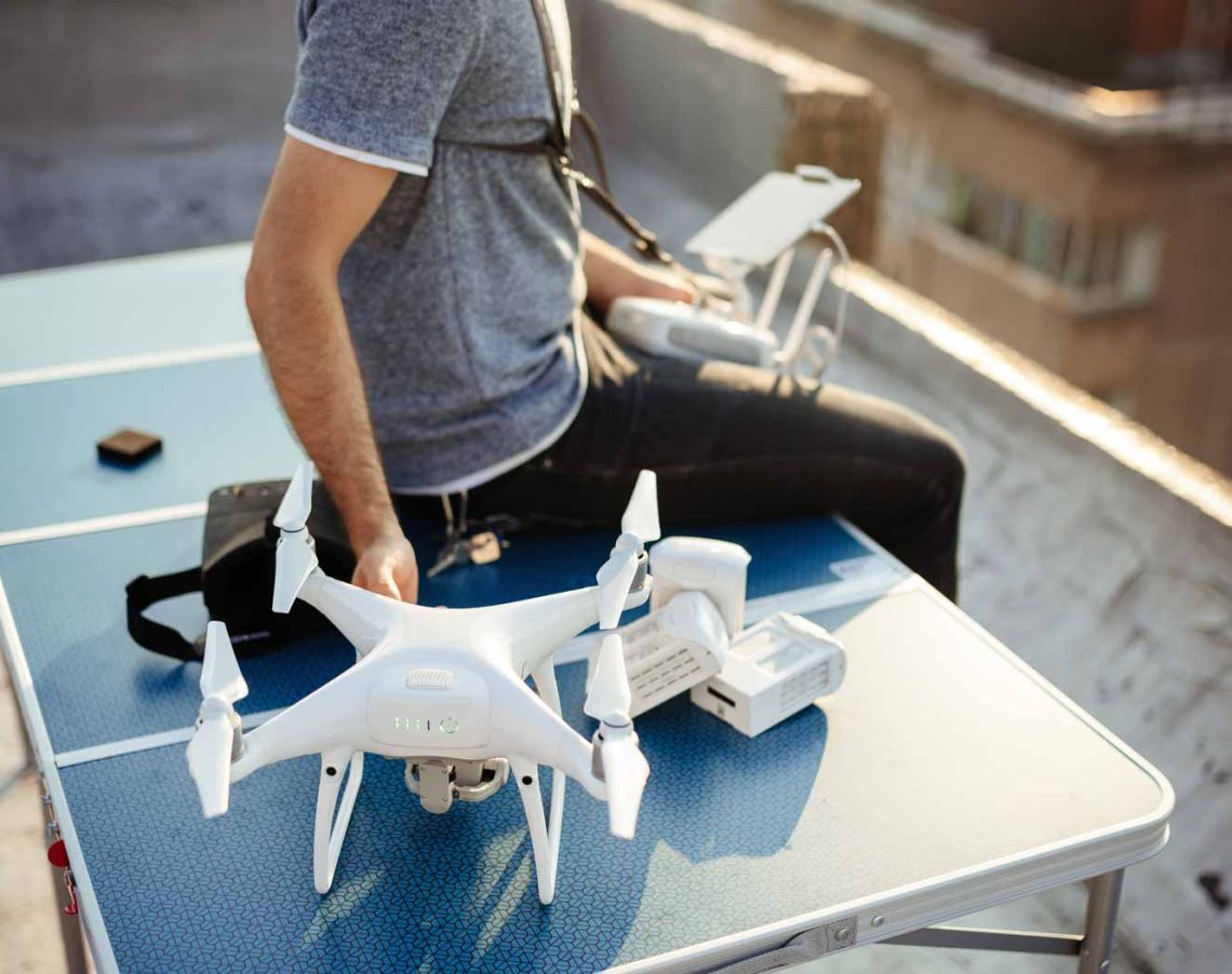 man-with-drone-flying-at-the-city-on-rooftop-KLF9A8N.jpg